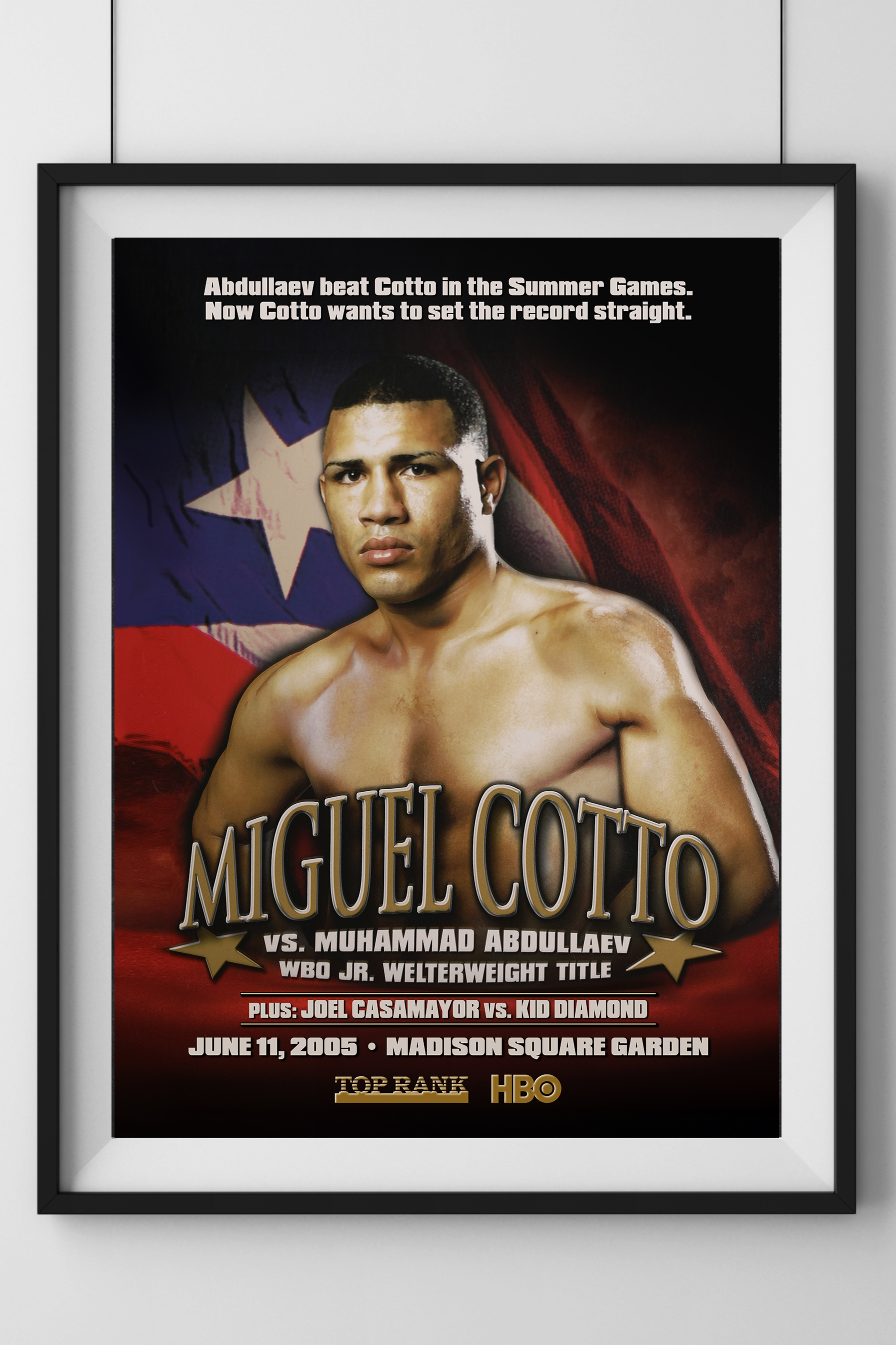 Framed poster of Miguel Cotto with promotional text on a white wall