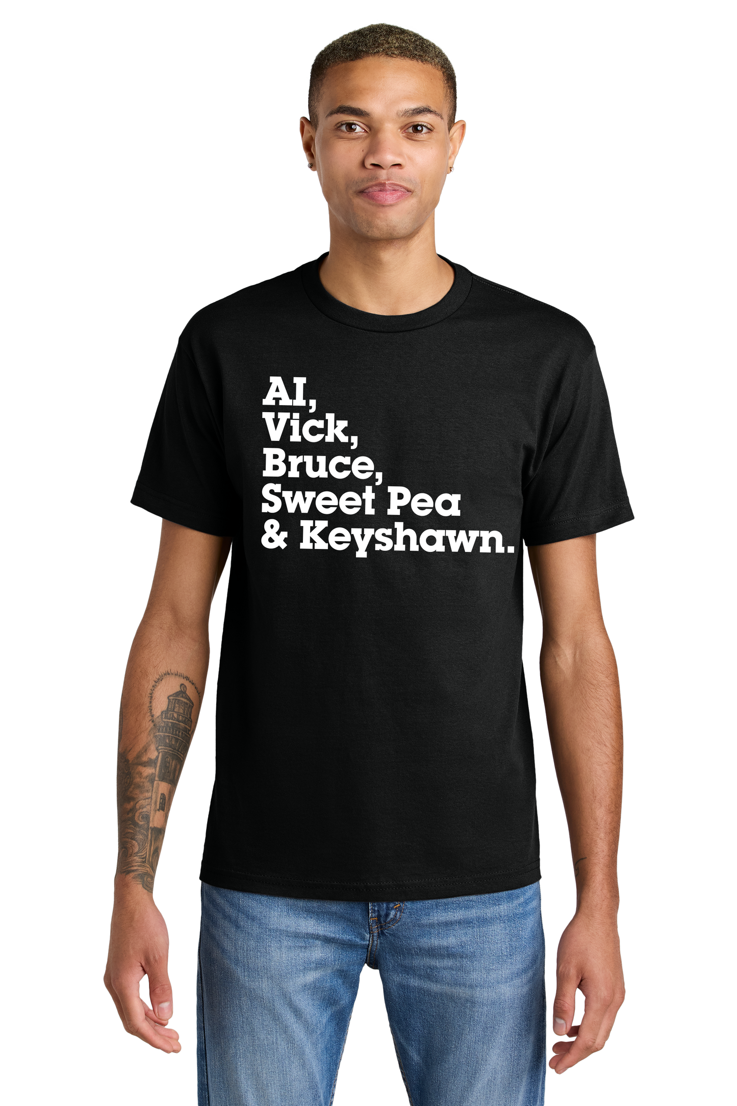  A man wearing a black t-shirt featuring bold white text that reads "AI, Vick, Bruce, Sweet Pea & Keyshawn." The shirt pays tribute to legendary athletes from Norfolk, including Allen Iverson, Michael Vick, Bruce Smith, Pernell "Sweet Pea" Whitaker, and Keyshawn Davis. 